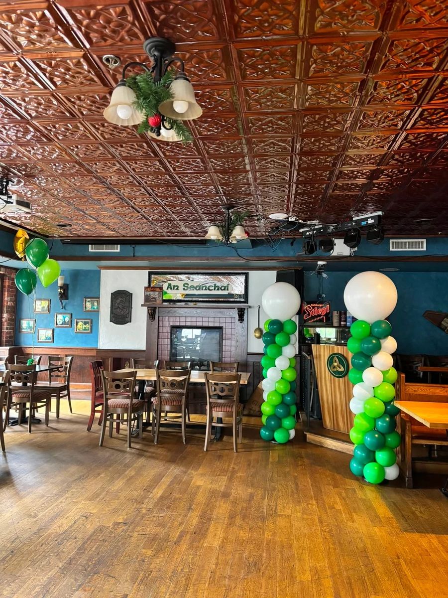 Green and white columns with white toppers inside a pub