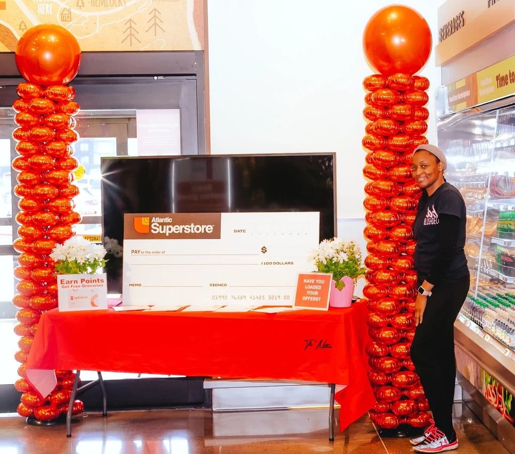Atlantic Superstore cheque presentation framed by orange columns