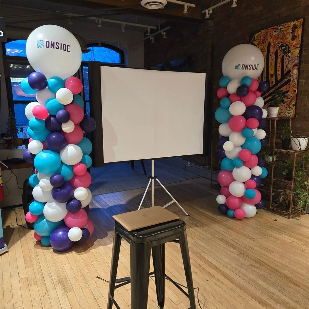 Teal, purple, pink and white columns with Onside logo toppers