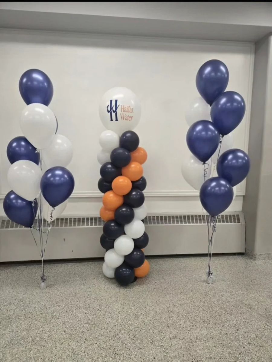 Navy, orange and white column with navy and white helium bunches