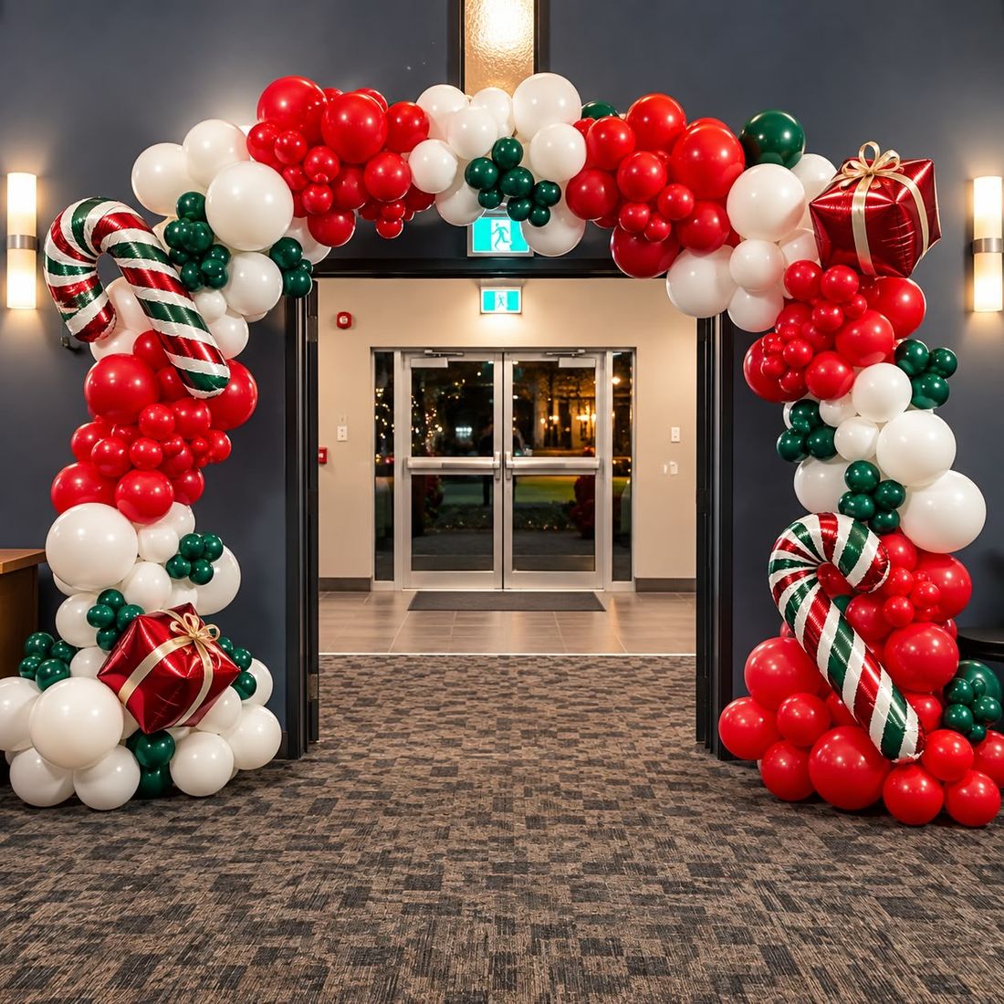 Red, white and green holiday garland with candy cane and gift box foils framing a church doorway
