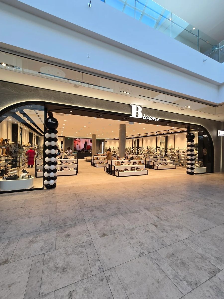 Black and white columns at a mall store entrance